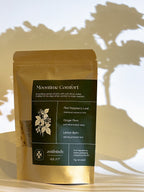 Gold package of 'Moontime Comfort' with green label on a wooden surface